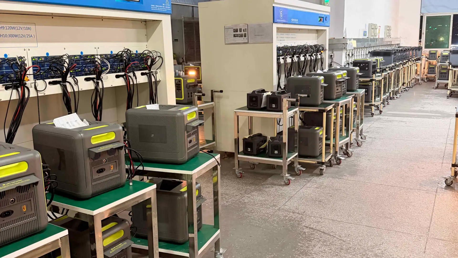 Portable power stations undergoing aging tests on a factory production line