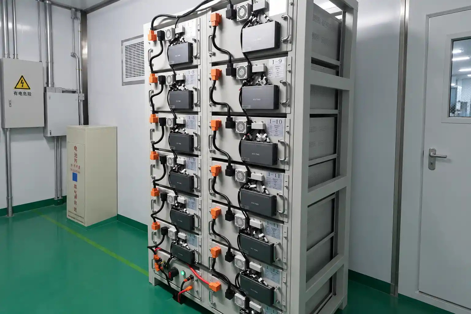 System integration bench with BMS wiring and rack assembly validation
